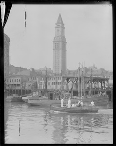Fishing boats at old T-wharf, Custom House Tower in background