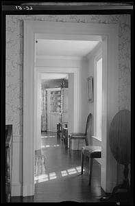 A glimpse through the front hallway into the reeded room, Antiquarian House, Concord