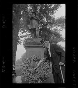 Elderly veteran puts flowers at Civil War general's statue, Boston Public Garden