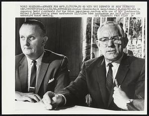 United Steelworkers secy-treas. I.W. Abel (R), who is opposing David J. McDonald for the Union presidency, confers with one of his lieutenants, Walter J. Burke, during press conference 11/10. The news conference was held after the USW executive board meeting.