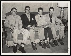 Resting Up at the Hotel Kenmore before today's game with the Braves are these members of the Pittsburgh Pirates. Left to right, they are Infielder Dick Groat, Pitcher Bob Friend, Batboy Don Pisera and Infielder Sonny Senerchia.