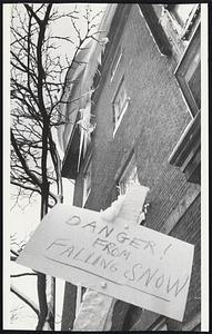 Warning Sign guards sidewalk at 53 Mt. Vernon St. where overhanging snow poses serious threat to pedestrians.