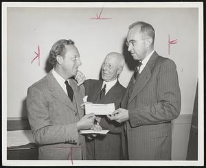 Community Fund Sendoff in the amount of $60,000 is presented in behalf of Lever Bros. Co. by its president Charles Luckman, left, to Charles Francis Adams, fund president, center, and Philip H. Theopold, 1948 campaign chairman. The check was the largest received thus far by fund officials.