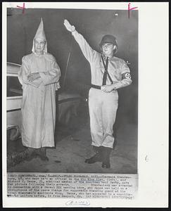 Self-Styled Klansman, Nazi--Clarence Brandenburg, 48, who says he's an officer in the Klu Klux Klan, (left), and Richard J. Hanna, 21, admitted member of the American Nazi Party, pose for picture following their arrests, Brandenberg was arrested in connection with a recent KKK meeting here, and Hanna was held on a disturbance of the peace charge for supposedly standing guard at the local Klansman's appliance shop. Hanna, who has appeared in a swastika-adored uniform before, is from Newport, Ky.