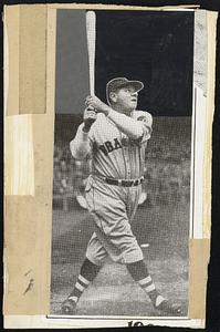 Babe Ruth holding his bat