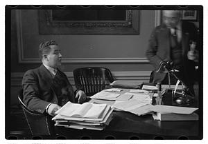 A man seated at a desk