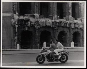Two people on a motorcycle