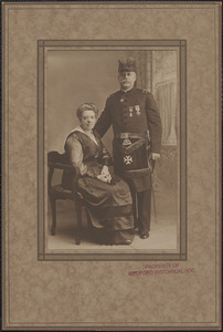 Unidentified officer with woman [wife]