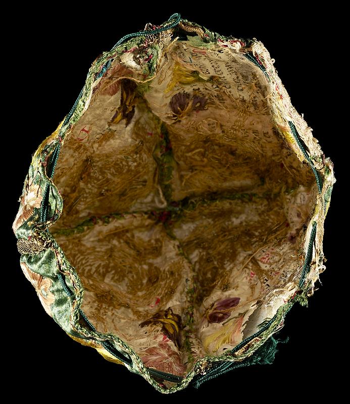 17th-century embroidered silk purse stabilized with fragments of medieval manuscript waste