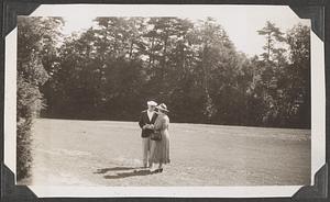 Gertrude Robinson Smith, Festival President, and Dr. Koussevitzky, musical director of the Boston Symphony Orchestra, talking things over at Tanglewood