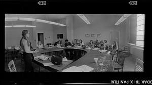 Journalism class at copy reader's "horseshoe" desk, Boston University School of Public Communication, Boston