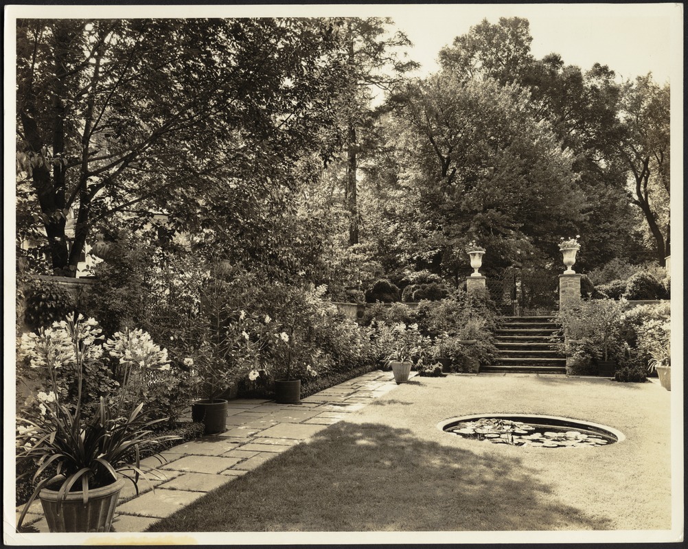 Ashdale Farm. Rose garden, reflecting pool and potted plants; stair entrance with urns on right