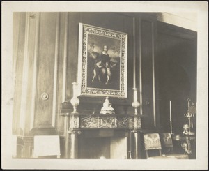 Formal living room with fireplace; painting above mantel