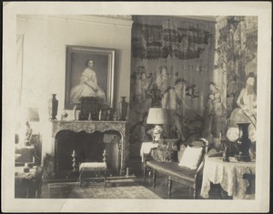 Interior — Sitting room looking towards fireplace, tapestries on right