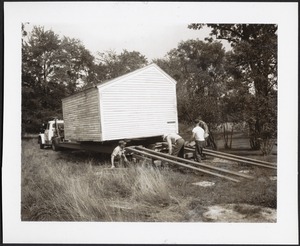 Moving an outbuilding onto flatbed truck