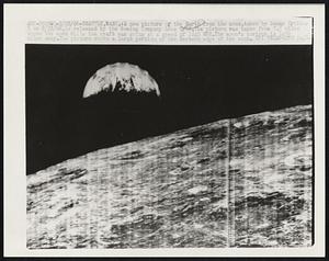 Seattle, Wash. : A new picture of the Earth from the moon, taken by Lunar Orbiter 1 on 8/23/166, is released by the Boeing Company here 9/28. The picture was taken from 745 miles above the moon while the craft was going at a speed of 2240MPH. The moon's horizon is 1400 miles away. the picture shows a large portion of the Eastern edge of the moon.