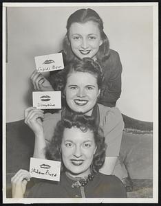 Boston beauties make up for Lovely Lips Contest sponsored by Massachusetts State Hairdressing and Cosmetologists' Association for Fifth Annual trade and Style Show of the lip-stickers at hotel Statler, Boston, Jan.22 through Jan. 25. reading top to bottom: Marjorie Kemp, with Cupid's Bow Lips; Evelyn Kenny, Vampire type, and Ruth Allen, Stream-lined.