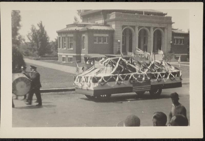 Parade passing Lawrence Library