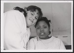 Two young girls smiling