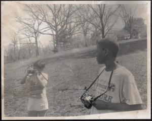 Two young photographers outside