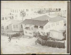 A house site cantered as high water rushes from the sea following hurricane "Gladys" attack on the Gulf coast area around Tampa and St. Petersburg 10/18.