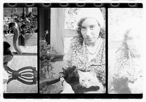 Unidentified woman holding cats