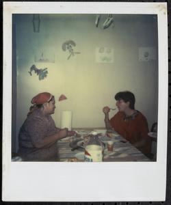 Two women eating at a table