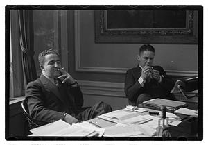 Two men seated at a desk