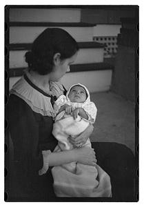 Mercedes Pasarell Sanromá holding a baby