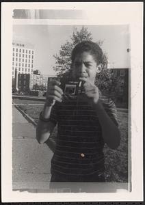 Young man taking a photograph