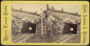 Three people standing on double track in Little Tunnel