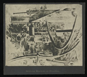 Hoosac Tunnel, its surroundings, workers, and machinery. Drilling machine at heading