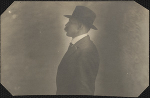 Profile photograph of a man in a hat