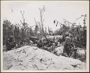 Two marines cautiously advance on a Japanese pillbox on Peleliu