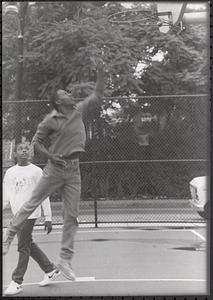 Omo Moses and Donovan Thomas playing basketball