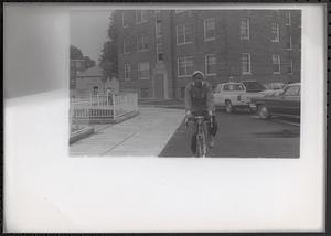 Young man riding a bike in Newtowne Court