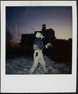 Boy walking through the snow