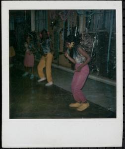 Brightly dressed girls dancing