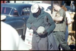 Man holding melon