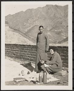 Two people next to the Great Wall