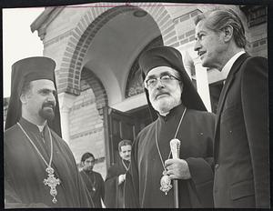 Standing outside Holy Cross chapel at Hellenic College in Brookline are, from left, the Very Rev. Maximos Aghiorgoussis, dean of theology; Archbishop lakovos and Rev. Dr. Leonidas Contos, president of the college.