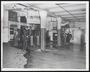 Underground Waterway was what the Boylston-Essex MTA station looked like yesterday after a water main broke at Boylston and Washington streets, cascading a flood which ripped up pavement, flooded cellars and swirled down the steps to the subway station. The MTA was prepared to shut off the power on its Everett-Forest Hills line, but the flow diminished and finally stopped before reaching the third rail. An emergency exit was opened on LaGrange street for MTA passengers. Above ground, Washington street was a virtual river between Boylston and Kneeland streets. Traffic was tied up about an hour.