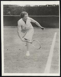 Wins over Cecilie Aussem in Wimbledon Semi-Finals Miss Elizabeth Ryan, who was declared the winner over Cecilie Aussem, popular German tennis star, in the Wimbledon semi-finals, when the latter sprained her ankle in the 9th game of the third set. Fraulein Aussem fell in trying for one of Miss Ryan's low drives to the backhand corner, and could not rise again. Because of the injury - she was taken from the court on a stretcher she was forced to default. Miss Ryan had won the first set 6-3, Fraulein Aussem the second at 6-0, and the third set had gone to 4-all when the German star was injured. It was latter announced that the injury was not serious. Photo shows Miss Ryan.