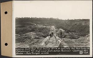 Contract No. 80, High Level Distribution Reservoir, Weston, looking southwest from Sta. 52+70 at concrete mat and curbs on embankment 3, high level distribution reservoir, Weston, Mass., Oct. 19, 1939