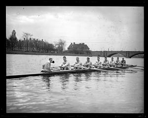 Harvard Crew rowing on the Charles, Larz Anderson Bridge and Weld Boathouse in background