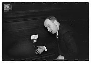 A man demonstrating how to break into a safe