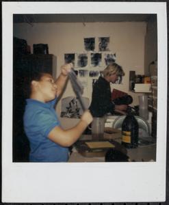 Susan Richards and boy hard at work in the photography room