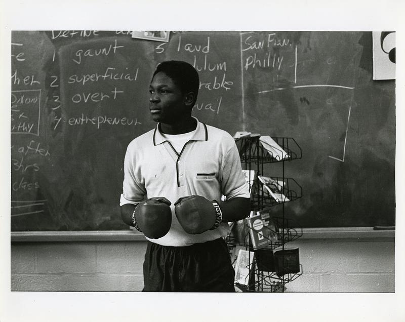 Student in boxing gloves