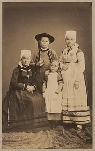 Studio portrait of women and girls in traditional Greek dress