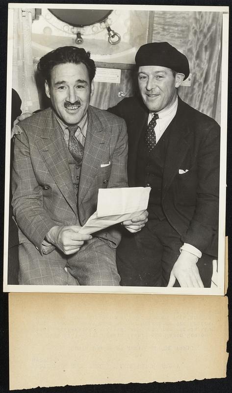 Acosta and Berry Arrive on the Paris. Bert Acosta (left) and Major Gordon Berry, well-known aviators, on board the French liner Paris today. They were met by agents of the Federal Burea u of Investigation who questioned them regarding their enlistment in the military forces of the Spanish Loyalist Government.